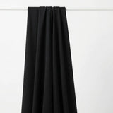 Polyester Viscose Stretch Scuba Knit Fabric, 250 gsm, 165 cm — Black — mockup: dress bodycon