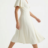 Polyester Stretch Interlock Knit Fabric, 238 gsm, 190 cm — Beige — mockup: dress bodycon