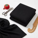 Polyester Viscose Stretch Rib Knit Fabric, 290 gsm, 160 cm — Black — mockup: dress bodycon
