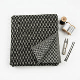 Black Houndstooth Interlock Knit, Polyester, 252 gsm — mockup: dress bodycon